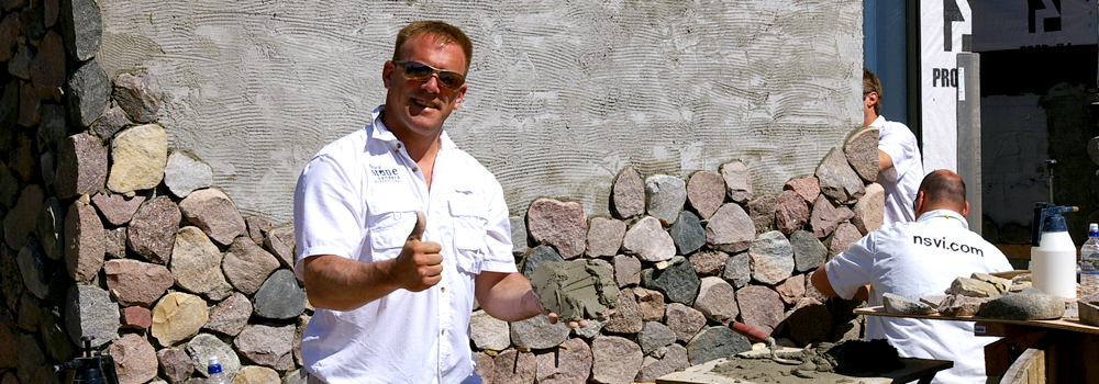 Volunteer completing stone work at The Children's House at Pinnacle Falls
