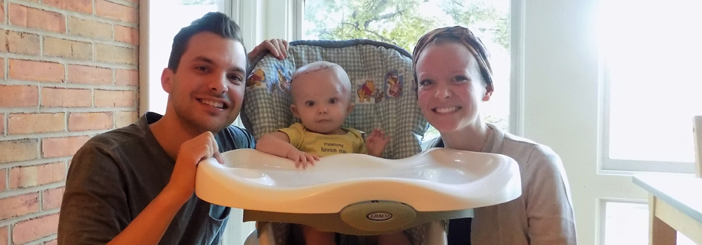 Mom and Dad with baby at The Believe In Tomorrow Children's House at Johns Hopkins
