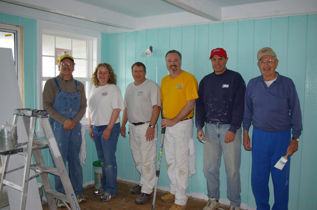 Believe In Tomorrow Corporate Partner The Dakes Company painting at the Children's House On The Bay