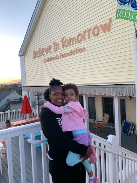 A Believe In Tomorrow Family on the deck of the house by the sea