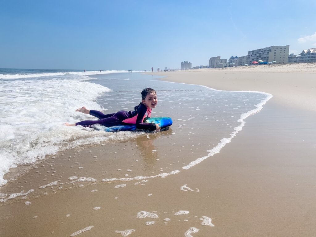 A young girl enjoying her Believe In Tomorrow respite at the beach