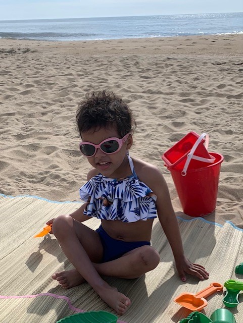 A Believe In Tomorrow Children's Foundation family on the beach featured in our stories